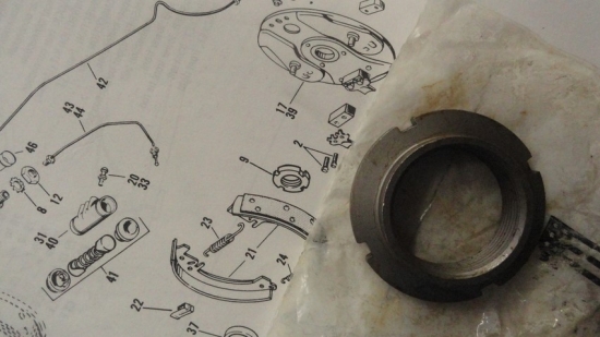 NUT TO HOLD SIDE PLATE TO AXLE